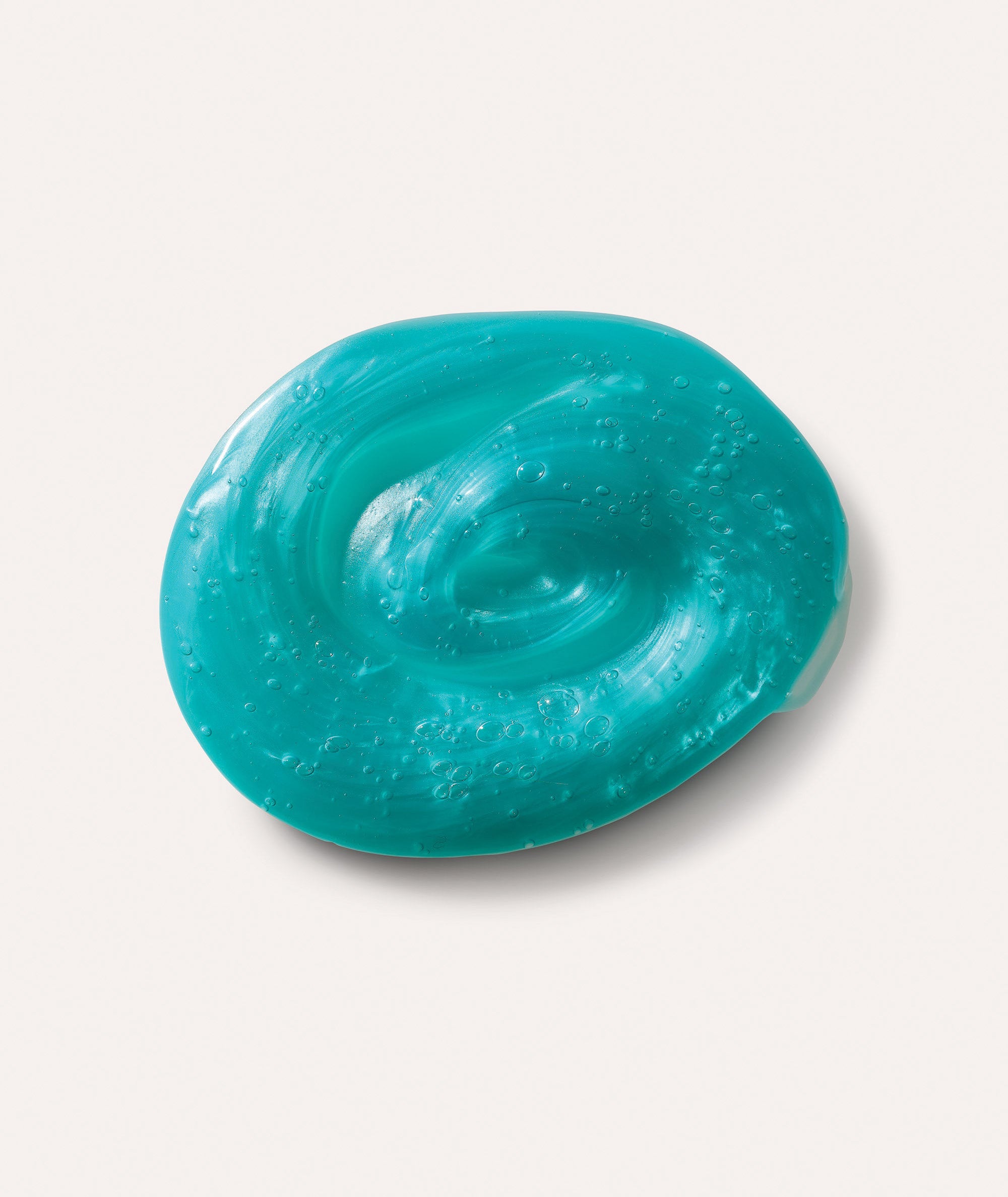 Product swatch of deep teal, iridescent gel texture of our Bagno di Vita Foaming Shower Gel