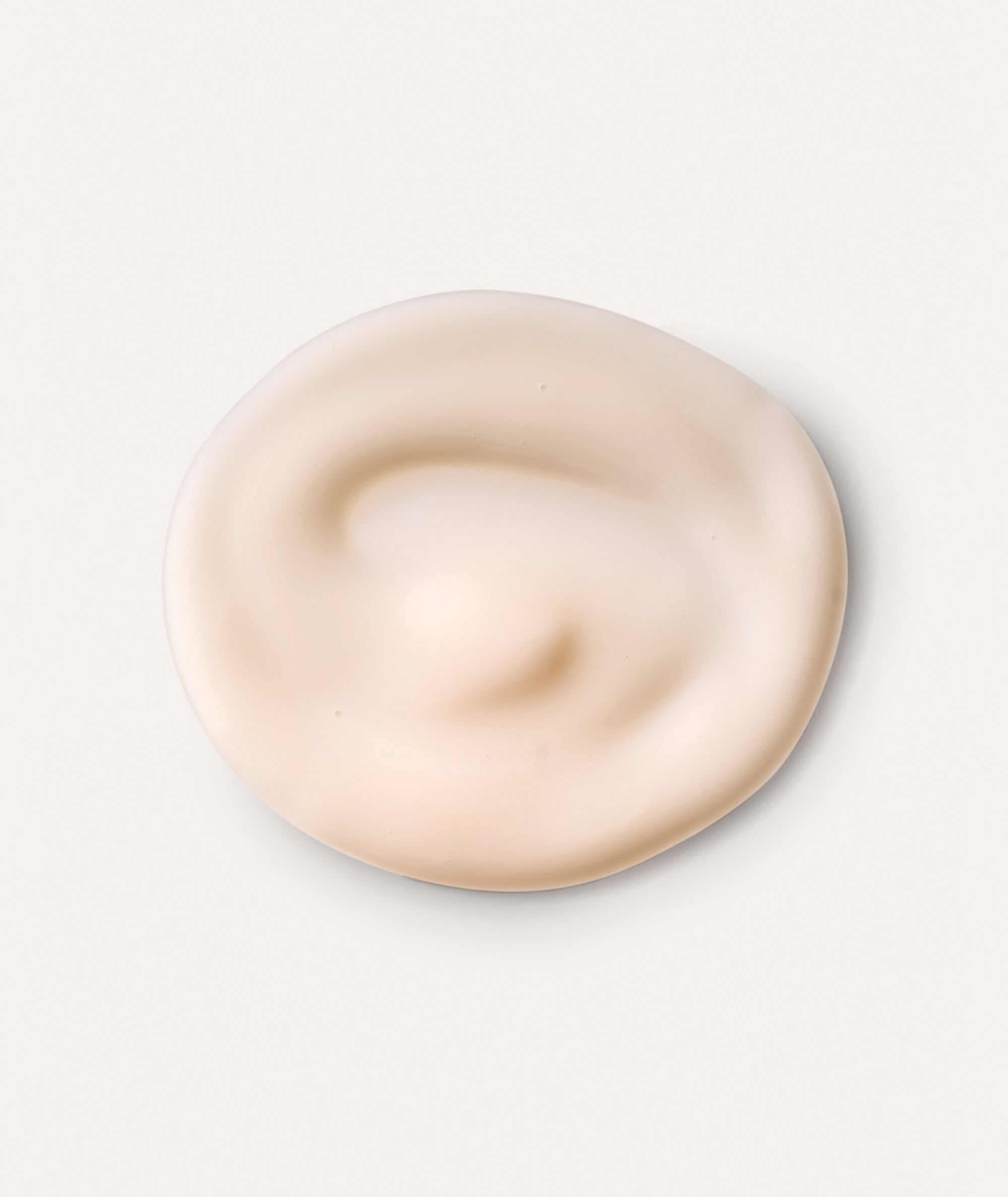 Product swatch showing the pink color and smooth, matte texture of our Equilibrio Equalizing Restorative moisturizer