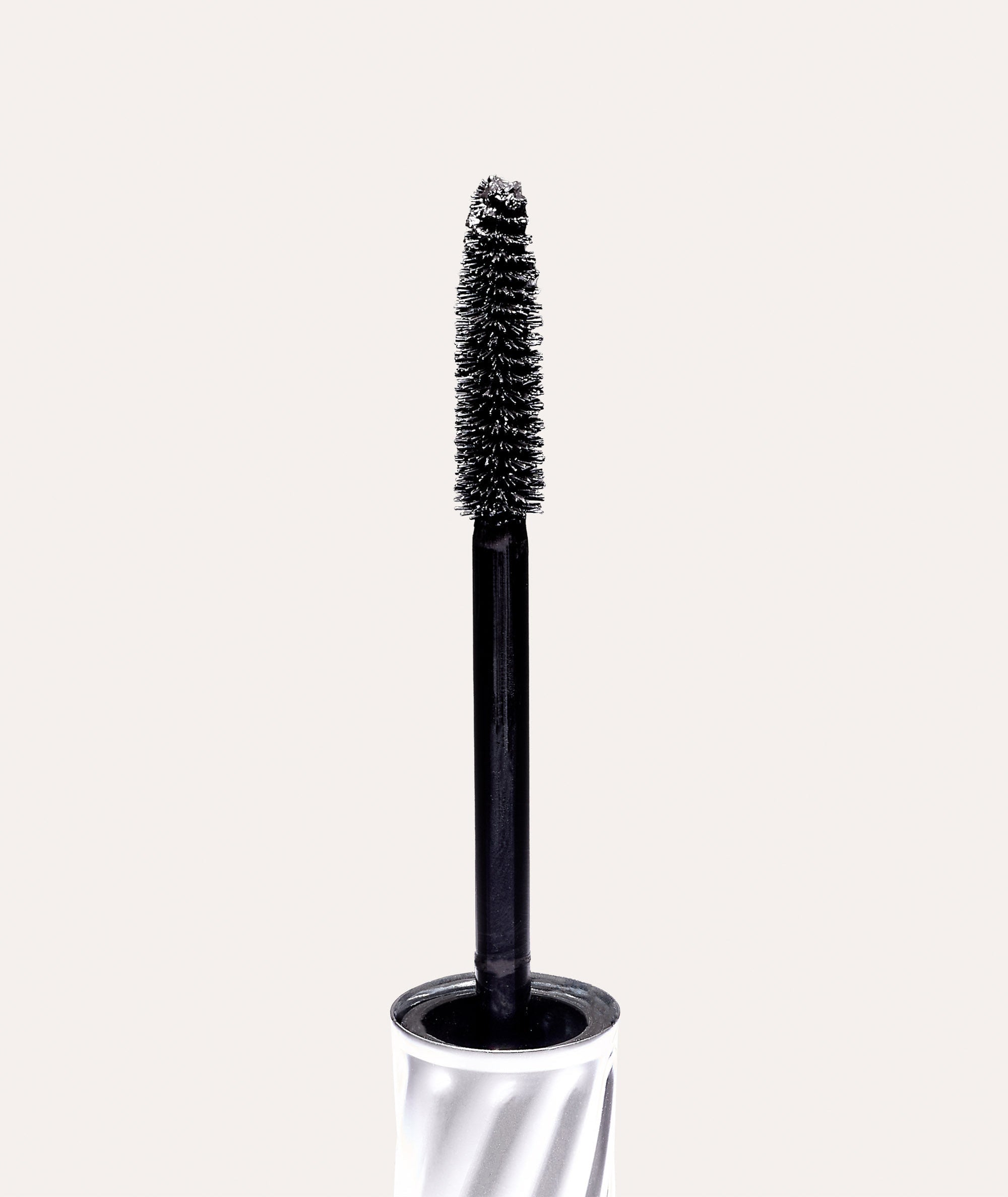 Closeup of the brush showing bristles and cone shape of Superiore State-of-the-Art Mascara spoolie