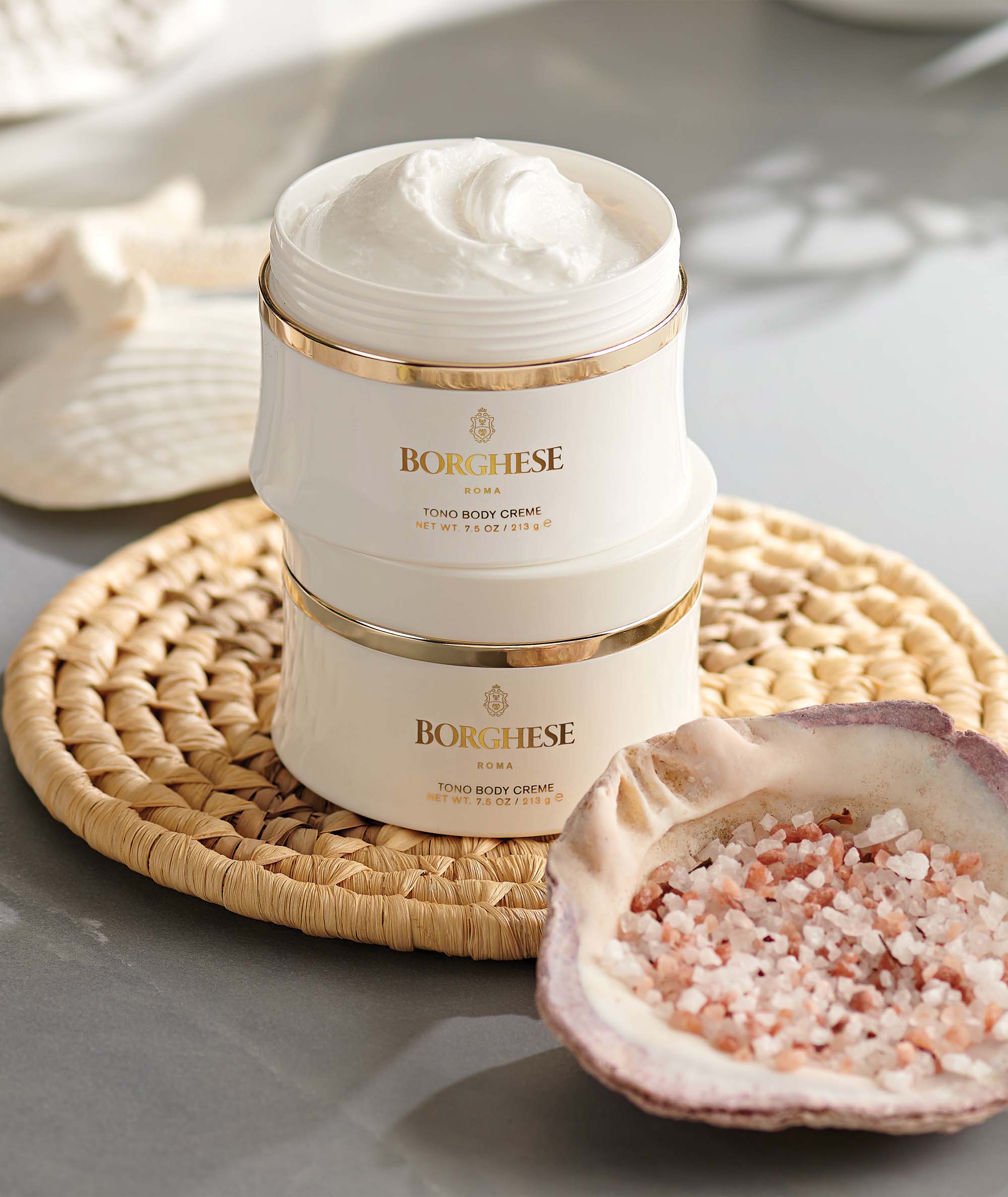 Multiple Tono Body Creme jars showing the luxury packaging and sea salt ingredient on a counter